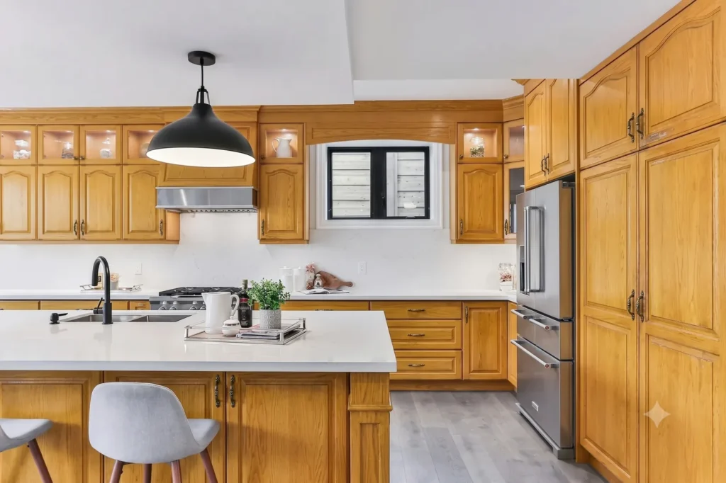 The same kitchen with dated honey-oak cabinet fronts, before refacing.