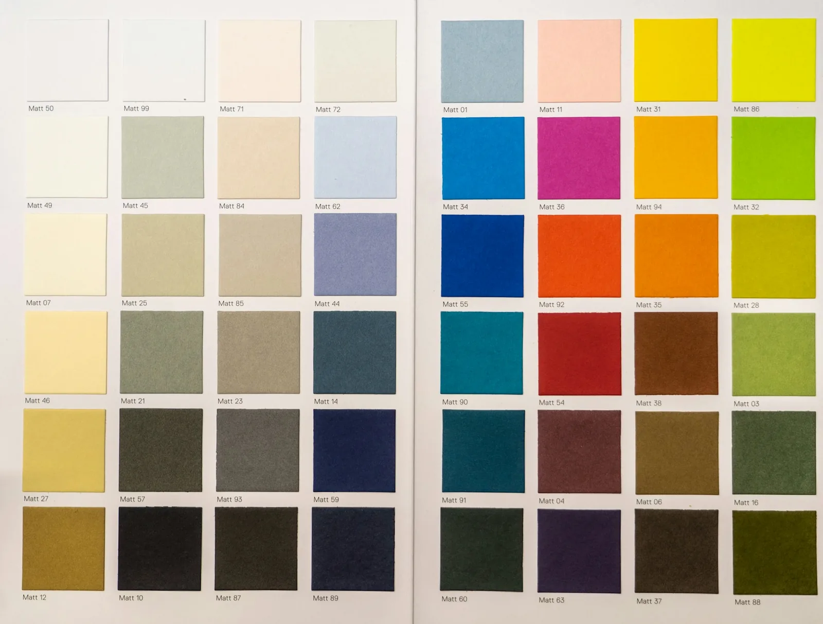 A fan of paint color swatches spread across the full spectrum.