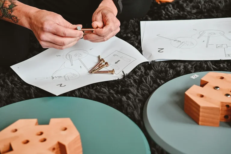 Flat-pack components, fixings and instructions laid out ready for assembly.