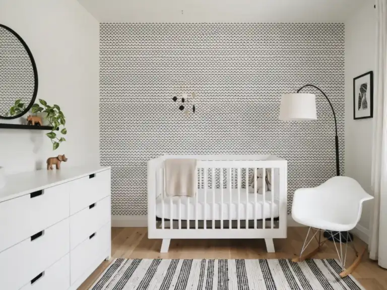 Small modern nursery with one wall of black and white scallop wallpaper behind a white crib, a black metal arc floor lamp and a striped rug